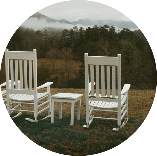 Two white rocking chairs at Blackberry Farm