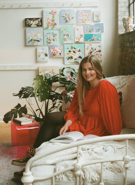 Fine art and textiles artist Kate Rawal posing in her studio