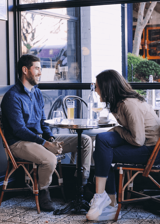 A girl being proposed to in a restaurant captured by Kent Collective Photography